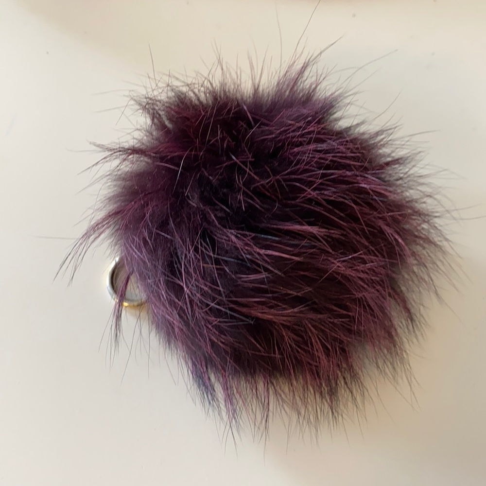 Micheal Kors purple pom pom